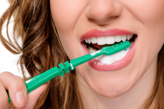 Woman brushing her teeth